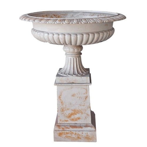 Freestanding outdoor concrete urn in white with marble finish on base